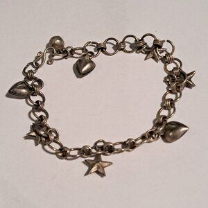 silver color charm bracelet with hearts and stars